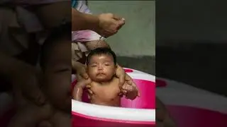 When a three month old baby girl  enjoys her bath.