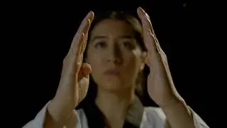 woman in withe kimono shows her karate skills