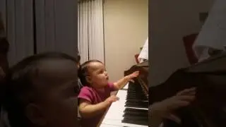 11 month Alexandria playing piano