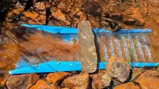 Rusty Water Through The RPE Sluice.