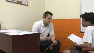 Alper Dama Teaching English to a High School Student in the Philippines
