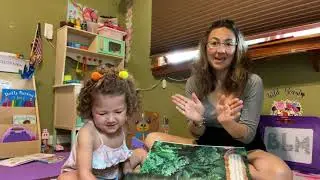 Thumbs Up by Mom Evelina on a Bookstand