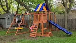 Assembling a Wooden Kids Playground with a slide & swingset