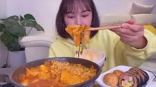 A person charging pot, rice, seaweed, cheese ball