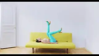Girl Wearing Blue Tights On A Yellow Couch
