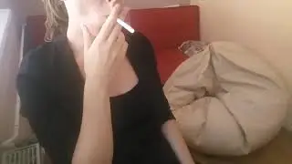 Cute young woman powersmoking cigarette