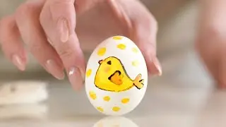 Drawing a Yellow Chick on an Easter egg