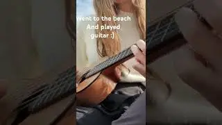 guitar on beach guitar on beach