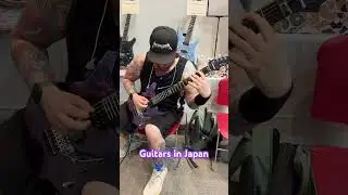 Playing metal guitar riffs in Osaka Japan