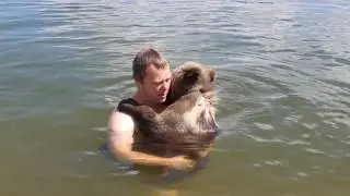 First bath with bear cub Mansur