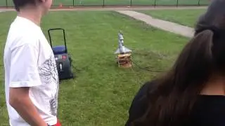 A Rocket Launch With A Barbie Doll Strapped Into It