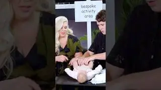 Dan Howell attempts to change a diaper.