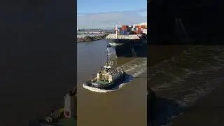 Container ship docking up-river, Melbourne (drone)