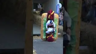 Hotdog soapbox car flips over 😂