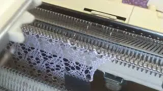 I'M KNITTING, BANDING, BUT HE'S DISAPPOINTED. SCHOOL APRON.