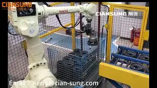 The vision-guided robot grips the workpiece and places it on the conveyor belt.