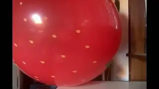 Blowing up a big strawberry balloon! 🍓