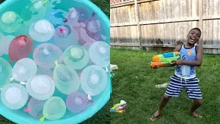 Water balloons and water guns fight with my little brother