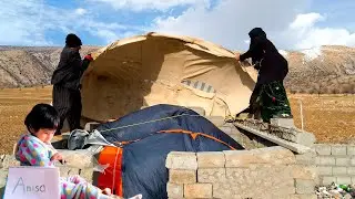 New experience: strong wind blows and Fatemeh keeps her tent on the roof of the house.