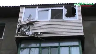 Попадание снаряда в балкон на пятом этаже дома по пр. Ленина, 166, 14.07.2015