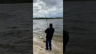 Reeling in a huge fish! Fishing.