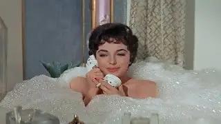 Joan Collins... smoking cigarette in The Opposite Sex  🚬