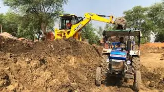Jcb 3dx Eco Excellence Backhoe Machine Loading Red Mud In Powertrac Tractor, Mahindra Tractor
