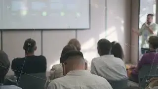 Speaker engaging audience in a professional conference setting