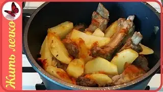 PORK RIBS IN A CAULDRON ON THE STOVE