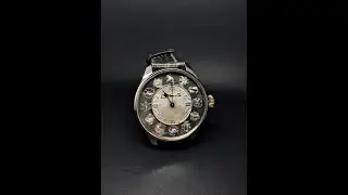 Hy Moser & Cie sterling silver dial.