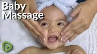 This baby is absolutely loving her facial massage