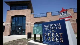 The National Museum of the Great Lakes & a tugboat & a cargo ship in Toledo, Ohio
