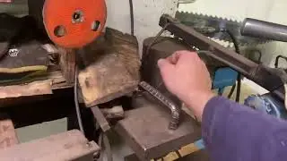 Twist removal from wide bandsaw using “tapered board” method