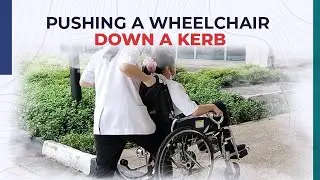 Pushing a Wheelchair Down a Kerb