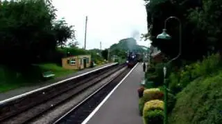 'Up' service train arrives and departs Medstead & Four Marks station on the Mid Hants Railway, UK