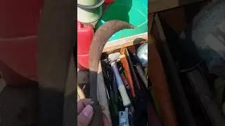 Amateur restoring a rusted sickle. Incomplete with paint finish.
