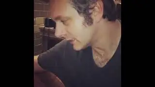 Michael Sheen kissing a dog's belly