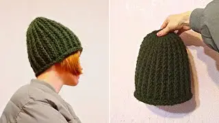 Crochet beanie hat with a raised rib stitch made from thick yarn and a trim at the bottom