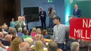 NATO protestors interrupt Tánaiste Micheál Martin at Government forum on neutrality