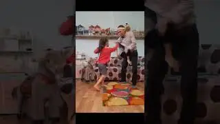 daddy playing with daughters doing karate