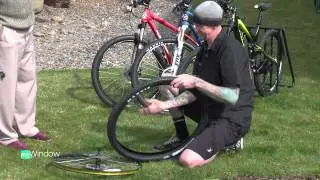 Fixing a bike flat at Bend Cyclery by John Hammarley