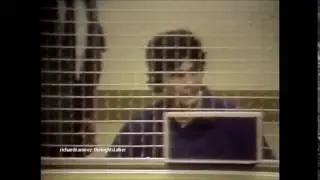 Richard Ramirez stands behind a wire cage at Santa Ana Courtroom. (rare footage)