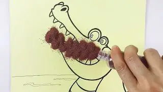 Sand drawing of a crocodile trying to eat a monkey