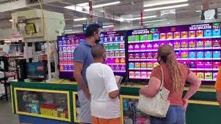 customers playing with the lottery display