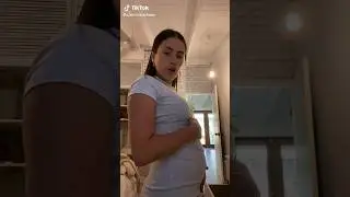 Alexandra shows a full belly 