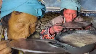 In a remote hilly village of Nepal, a grandmother is eating organic millet porridge all by herself.