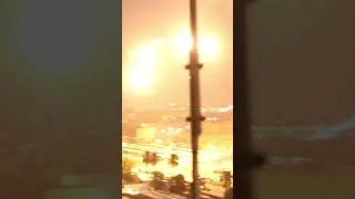 Apache helicopter launches flares over Baghdad during unrest near the US Embassy (2019). | 