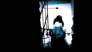 Horror Footage Royalty-Free Sample: Zombie walking down at stairs