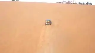 Nissan turbo climbs dune from start 0