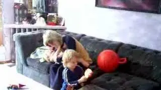 baby laughs as mom tries to lick his face